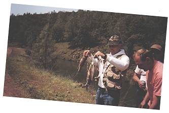 Dan Fallon holding limit caught one hour after sunrise on Battlecreek canal upper California 1997. ( Trout Opening day )