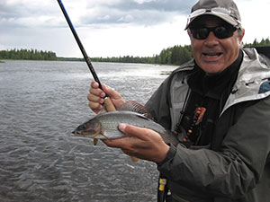 man with rod and fish