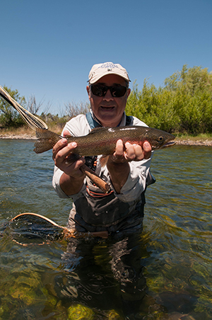man with rod and fish